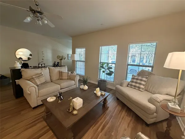 a living room with furniture and a large window
