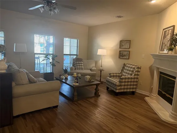 a living room with furniture and a fireplace