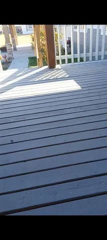 a view of balcony and floor to ceiling windows