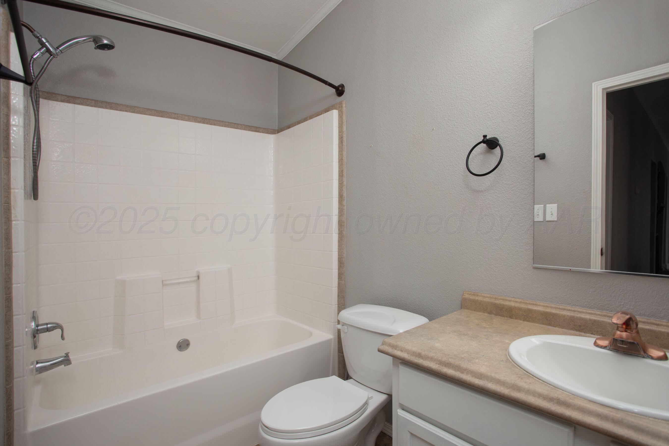 11000 Fox Street Amarillo, TX 79118 - Photo 25 of 40 a bathroom with a sink toilet and shower