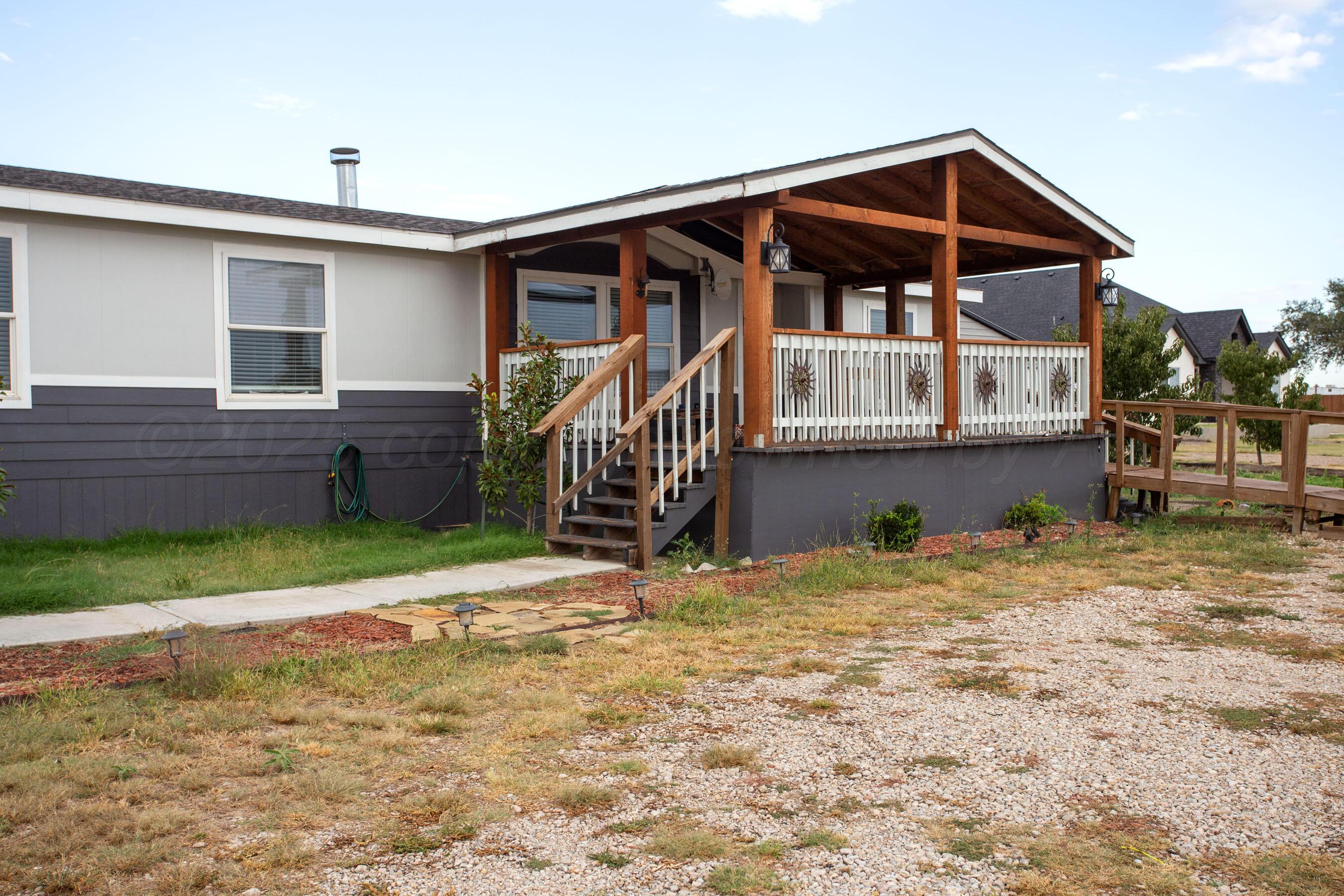 11000 Fox Street Amarillo, TX 79118 - Photo 26 of 40 a front view of a house with a yard