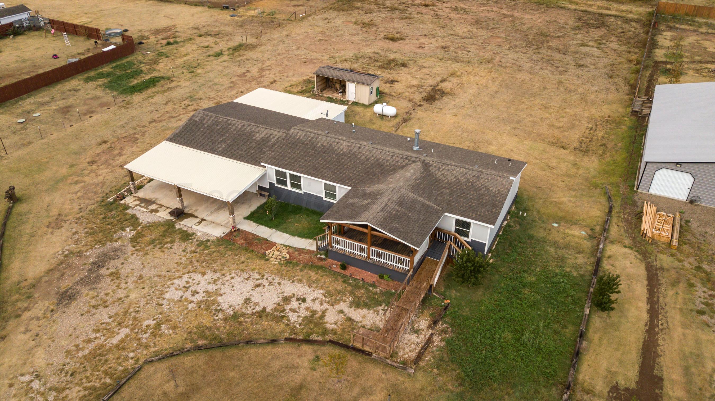 11000 Fox Street Amarillo, TX 79118 - Photo 35 of 40 an aerial view of a house with a yard