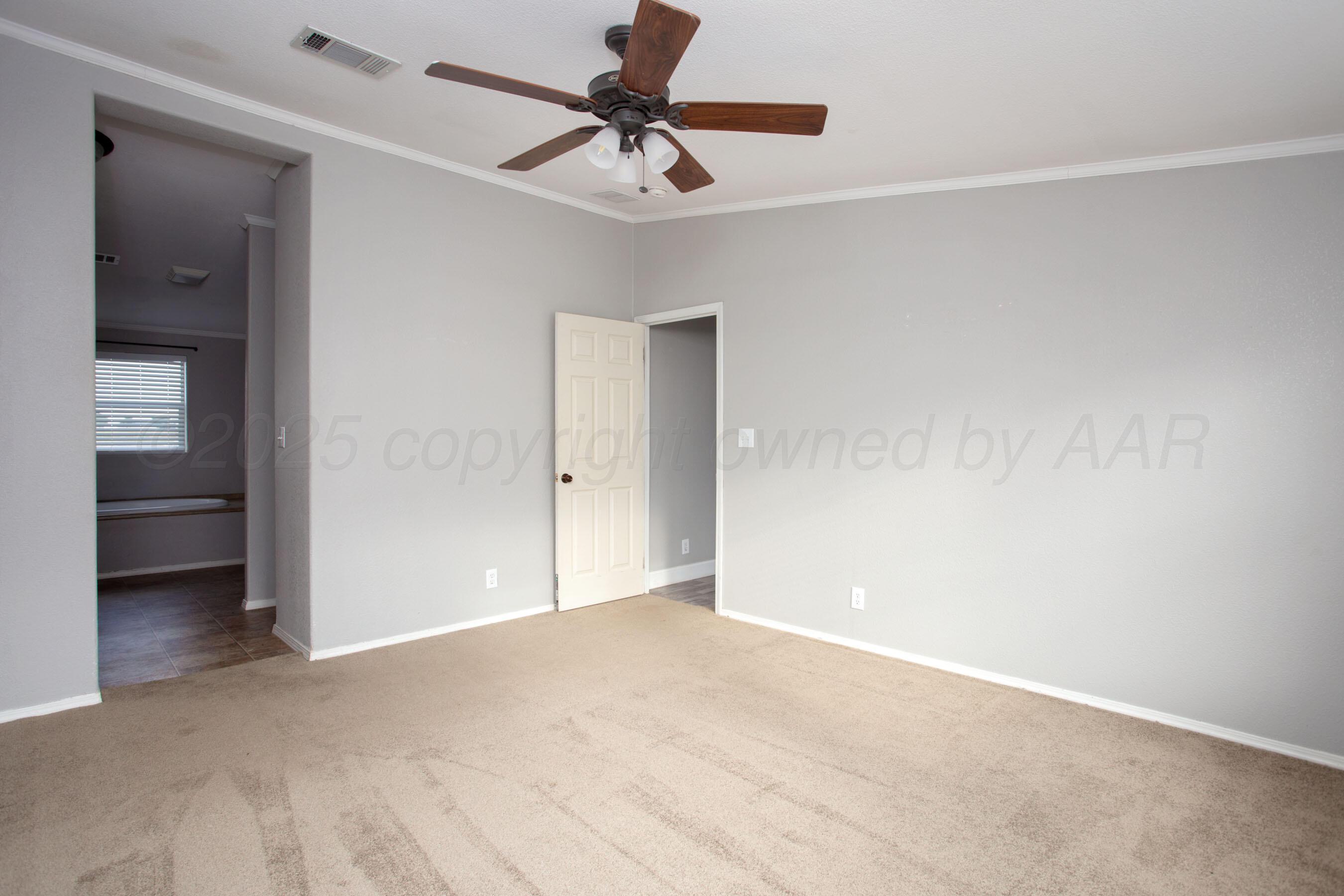 11000 Fox Street Amarillo, TX 79118 - Photo 36 of 40 a view of an empty room and a ceiling fan