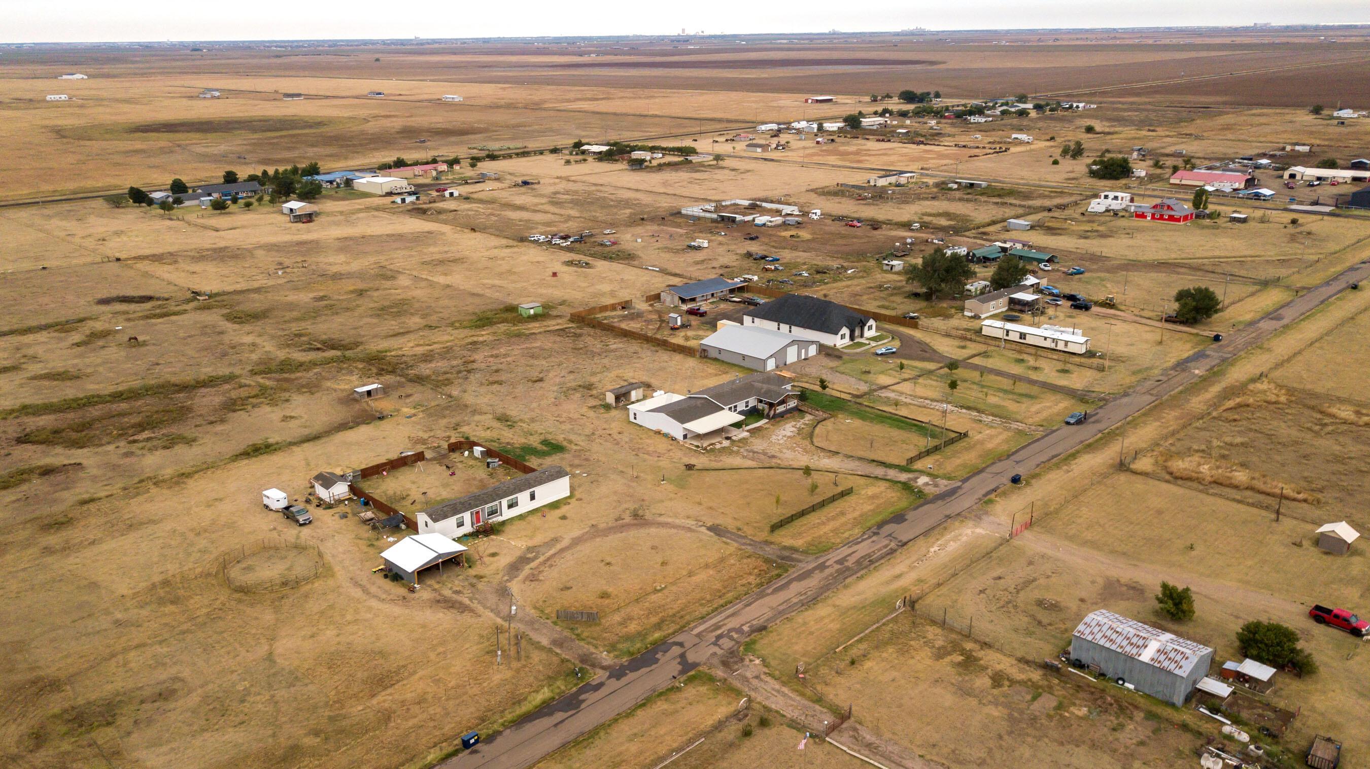 11000 Fox Street Amarillo, TX 79118 - Photo 4 of 40 an aerial view of residential building with parking space