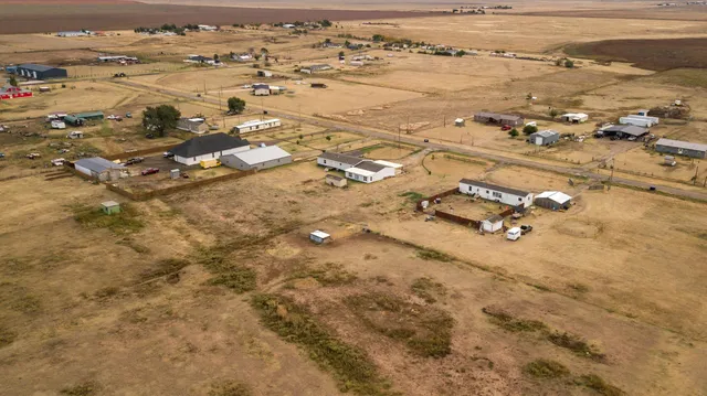 an aerial view of residential building with parking space