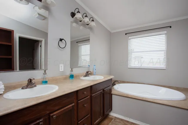 a bathroom with a granite countertop sink mirror and a toilet