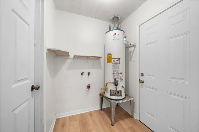 a view of hallway that has closet