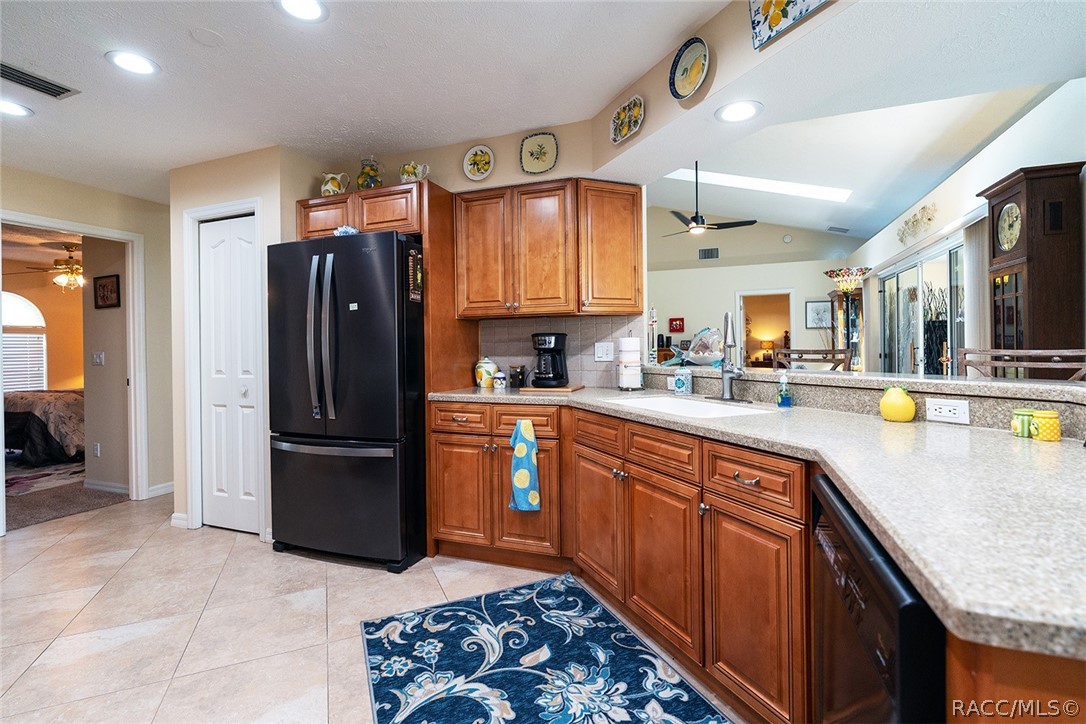 800 Balmoral Court Inverness, FL 34453 - Photo 17 of 72 a kitchen with stainless steel appliances granite countertop a refrigerator and a sink