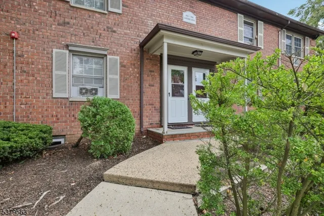 front view of a house with potted plants