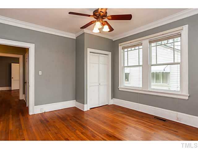 1519 Hanover Street Raleigh, NC 27608 - Photo 15 of 18 a view of an empty room with window and wooden floor