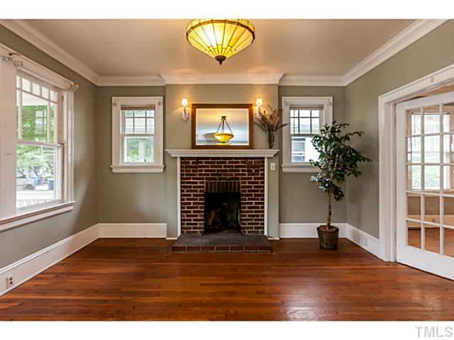 1519 Hanover Street Raleigh, NC 27608 - Photo 4 of 18 a view of an empty room with wooden floor and a window