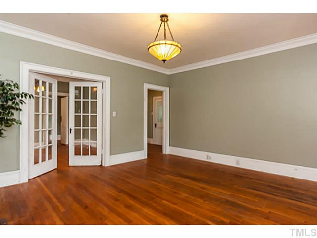 1519 Hanover Street Raleigh, NC 27608 - Photo 5 of 18 a view of an empty room with window and wooden floor