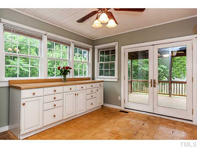 1519 Hanover Street Raleigh, NC 27608 - Photo 10 of 18 a open hall with wooden floor and windows