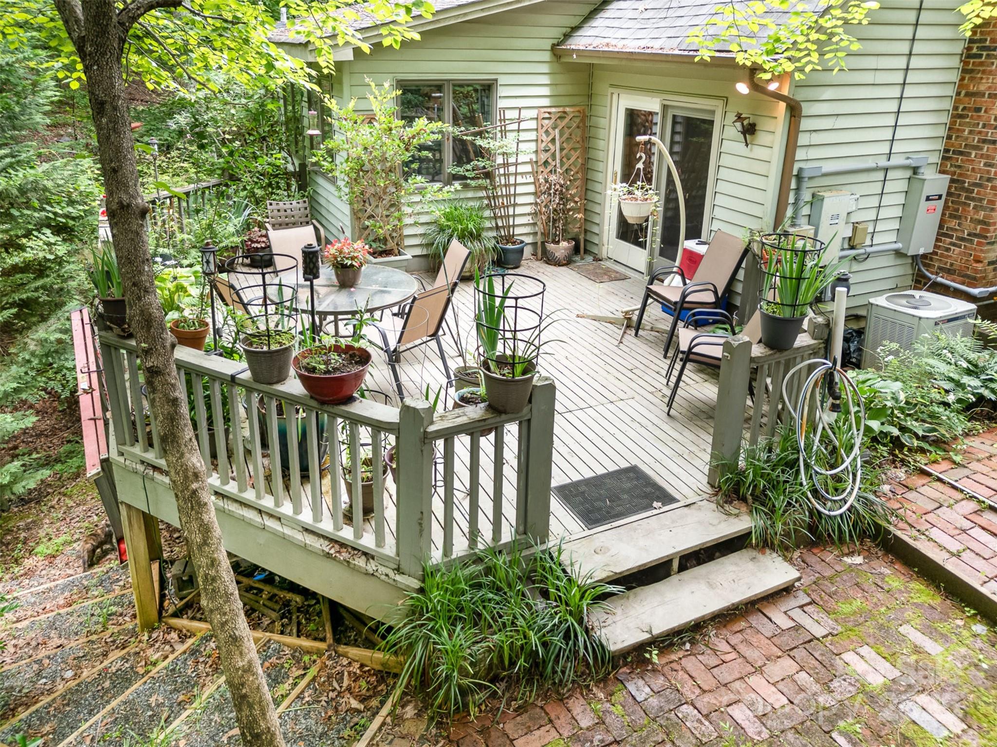 1102 Lake Montonia Road Kings Mountain, NC 28086 - Photo 12 of 48 a view of balcony with chairs and potted plants