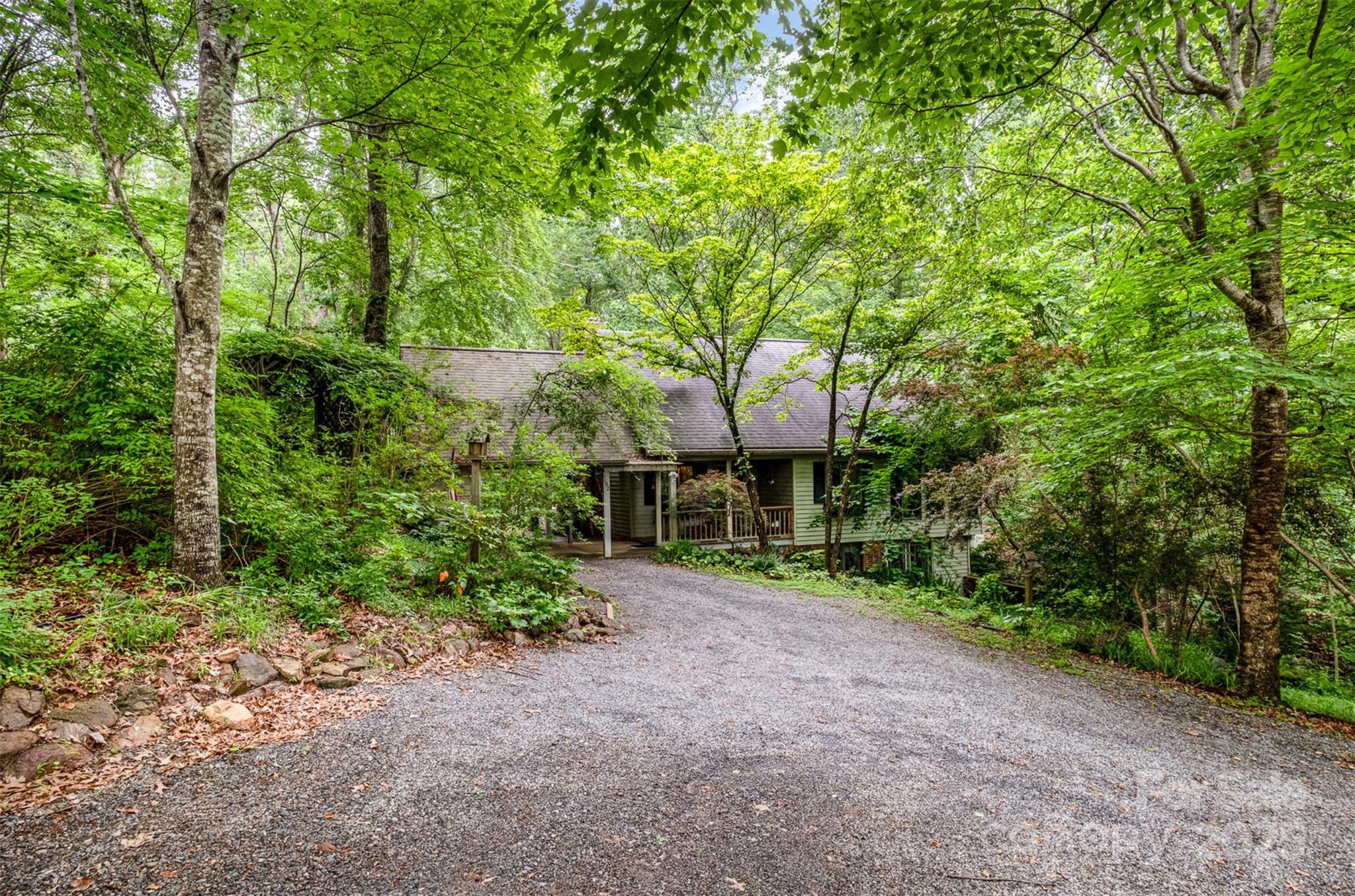 1102 Lake Montonia Road Kings Mountain, NC 28086 - Photo 13 of 48 a view of a house with large trees