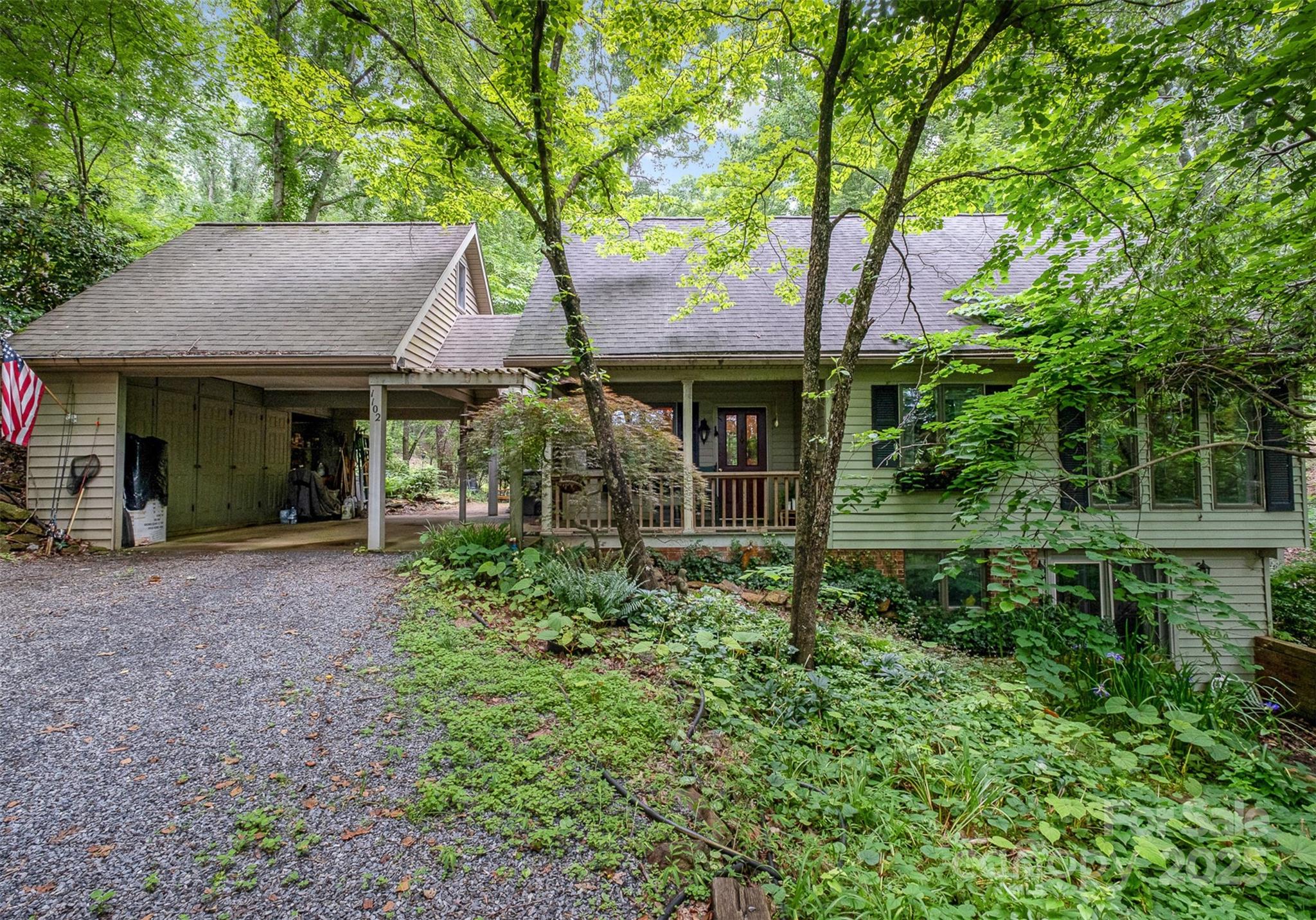 1102 Lake Montonia Road Kings Mountain, NC 28086 - Photo 14 of 48 a front view of a house with garden