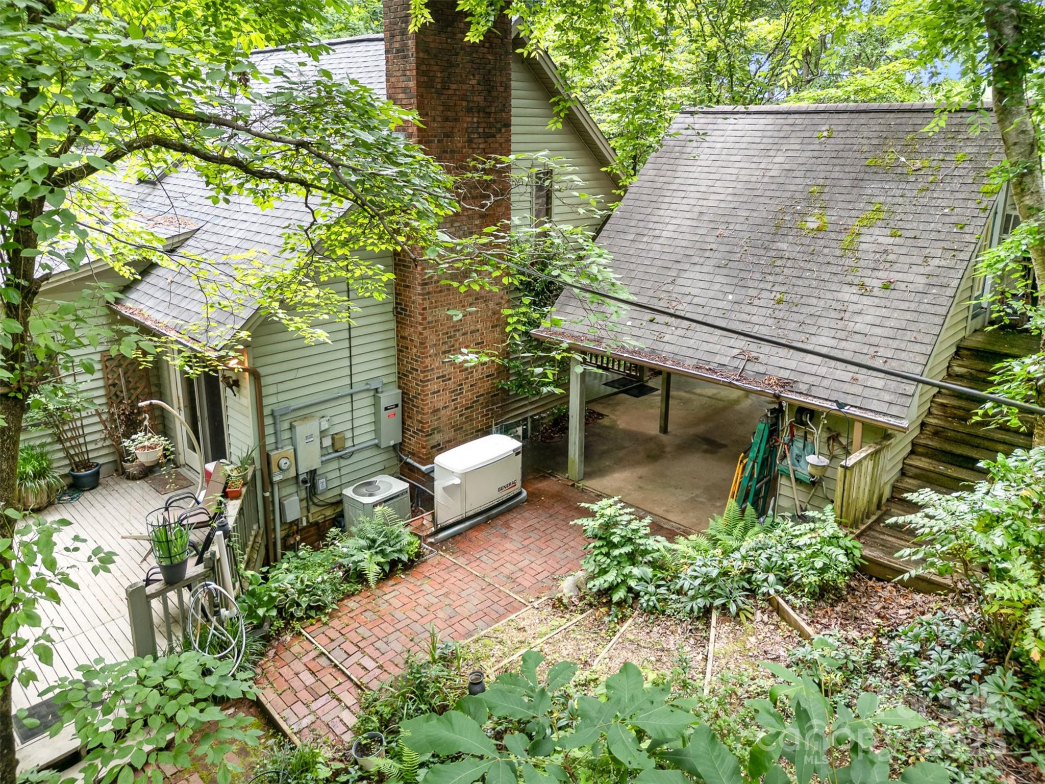 1102 Lake Montonia Road Kings Mountain, NC 28086 - Photo 15 of 48 a view of a backyard with sitting area