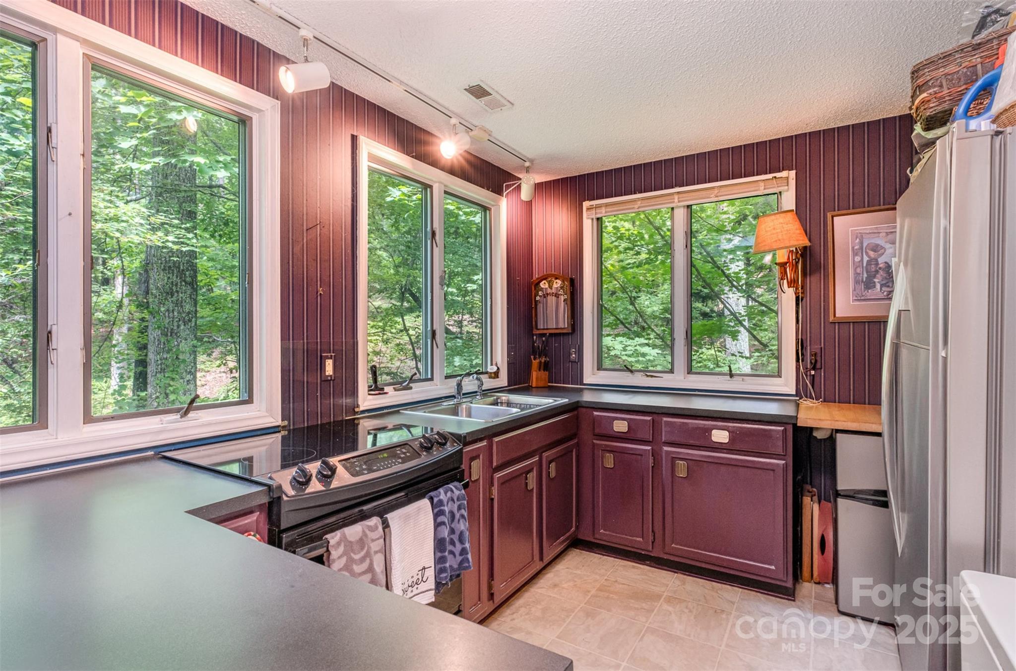 1102 Lake Montonia Road Kings Mountain, NC 28086 - Photo 27 of 48 a kitchen that has a sink and a stove