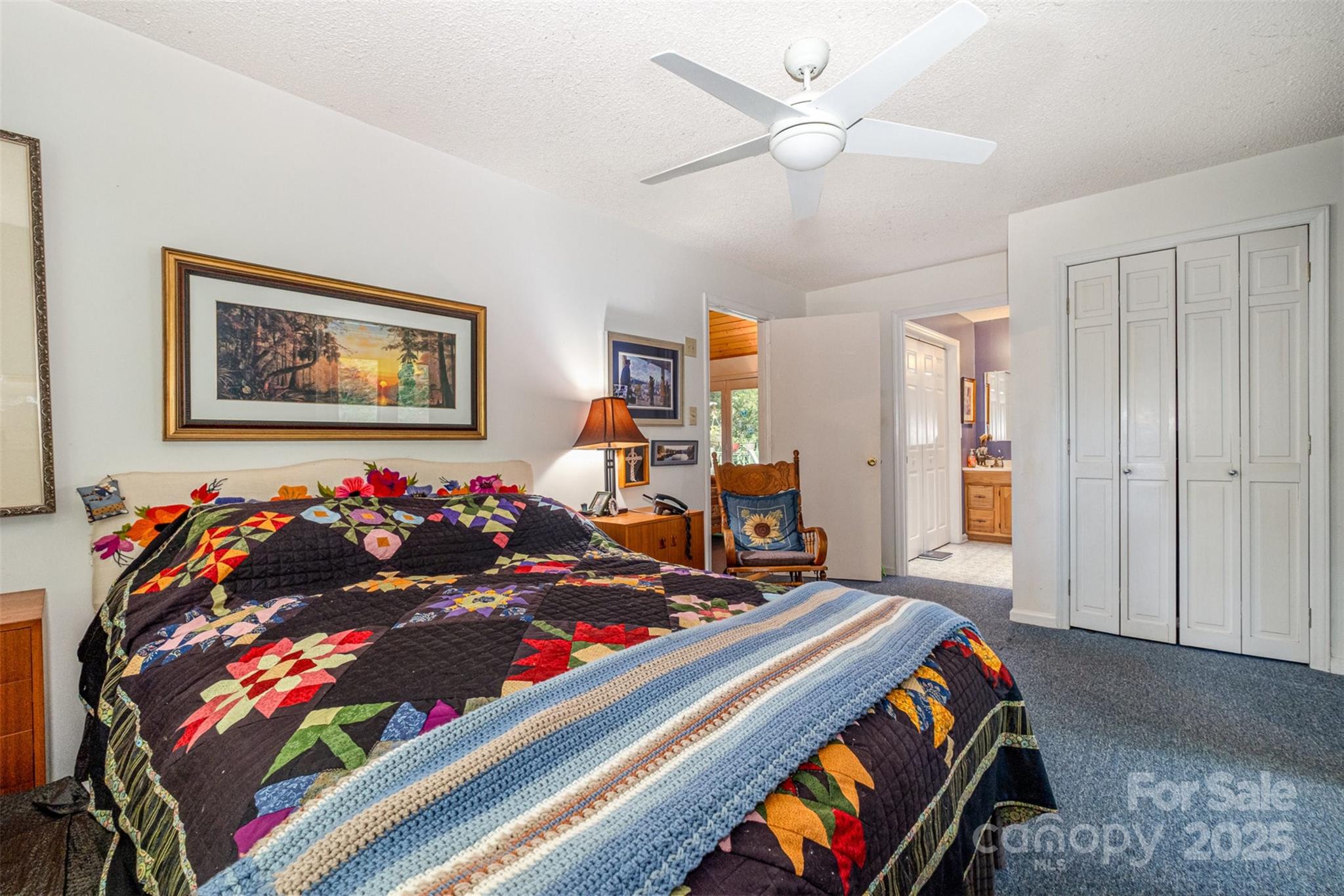 1102 Lake Montonia Road Kings Mountain, NC 28086 - Photo 32 of 48 a bed room with a bed and a painting on the wall