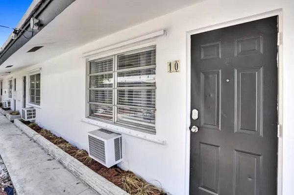 a bathroom with a window and a walk in closet