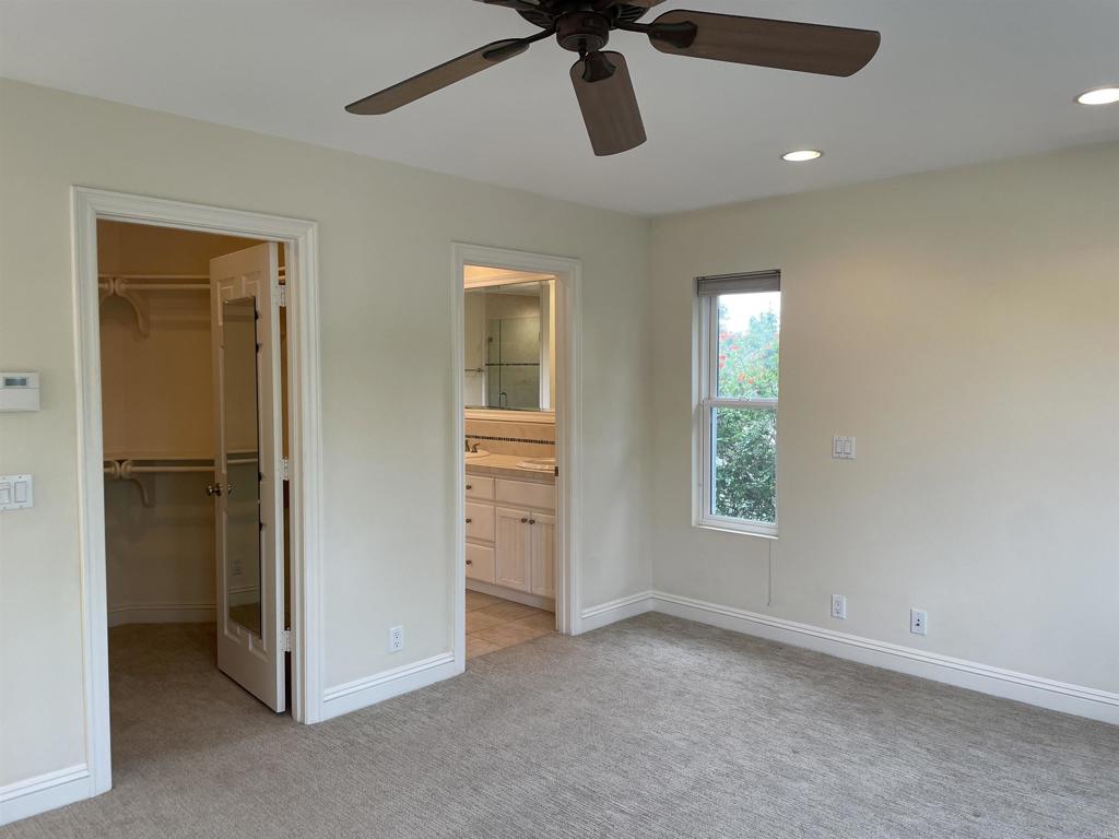 428 La Veta Avenue Encinitas, CA 92024 - Photo 13 of 25 an empty room with windows and closet