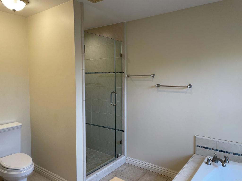 428 La Veta Avenue Encinitas, CA 92024 - Photo 16 of 25 a bathroom with a toilet and a shower