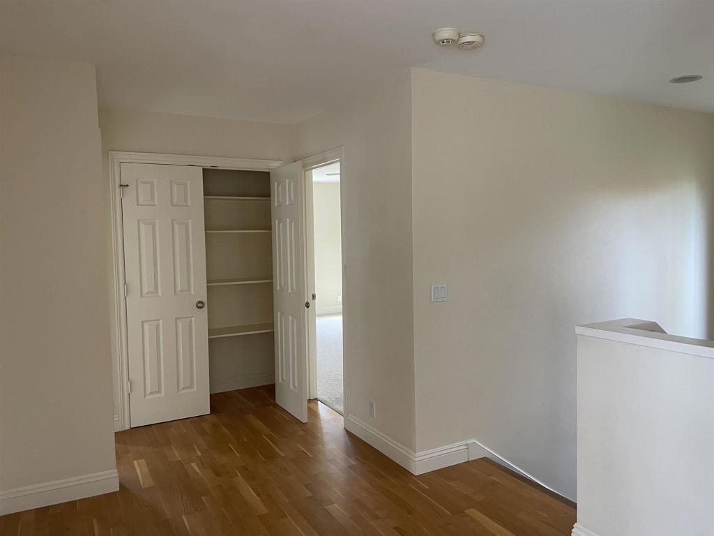 428 La Veta Avenue Encinitas, CA 92024 - Photo 17 of 25 a view of an empty room with wooden floor