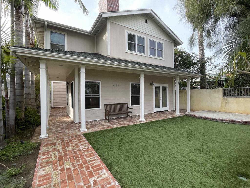 428 La Veta Avenue Encinitas, CA 92024 - Photo 2 of 25 a front view of a house with a garden and patio
