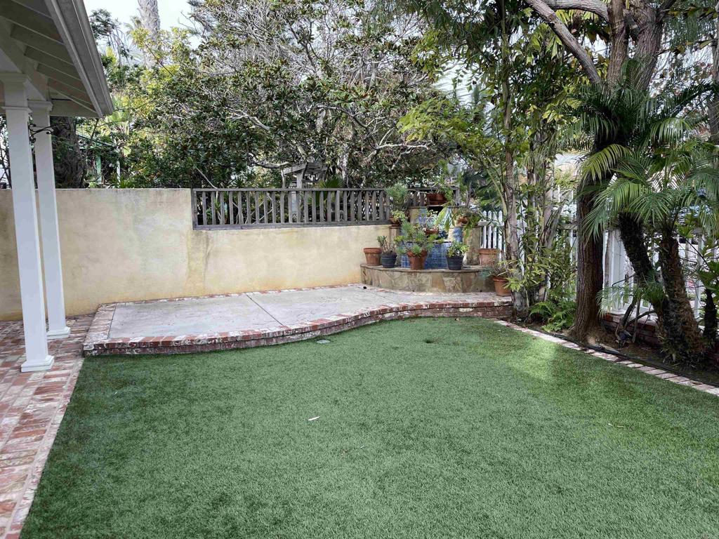 428 La Veta Avenue Encinitas, CA 92024 - Photo 3 of 25 a view of a backyard with a garden and tree