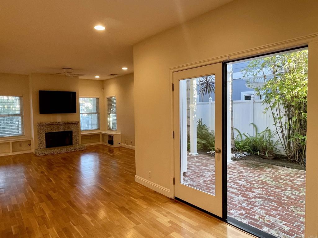 428 La Veta Avenue Encinitas, CA 92024 - Photo 6 of 25 a view of a living room with hardwood floor and a fireplace