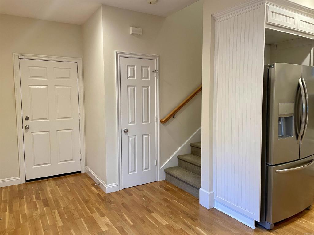 428 La Veta Avenue Encinitas, CA 92024 - Photo 9 of 25 a view of a hallway with wooden floor and entryway