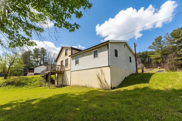 a view of a swimming pool with an outdoor space and seating area
