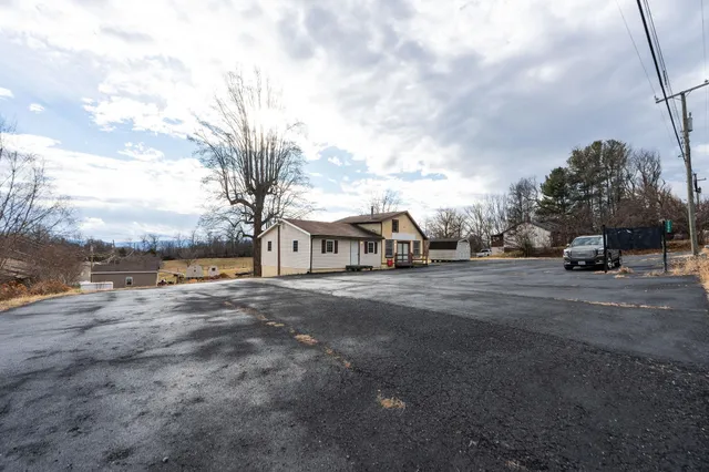 a view of a town with barn house