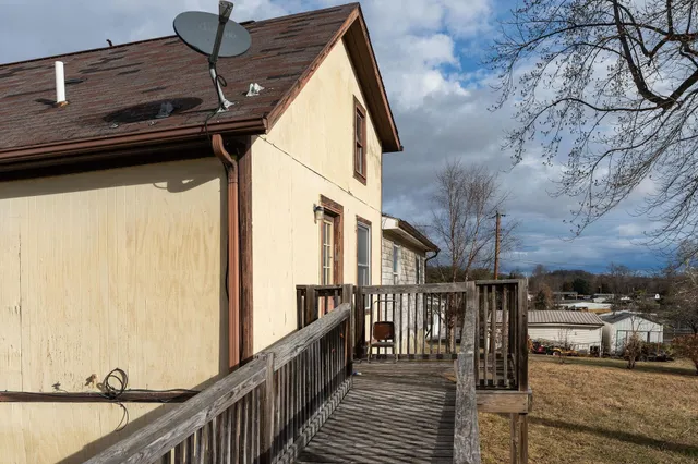 a view of a balcony with car parked