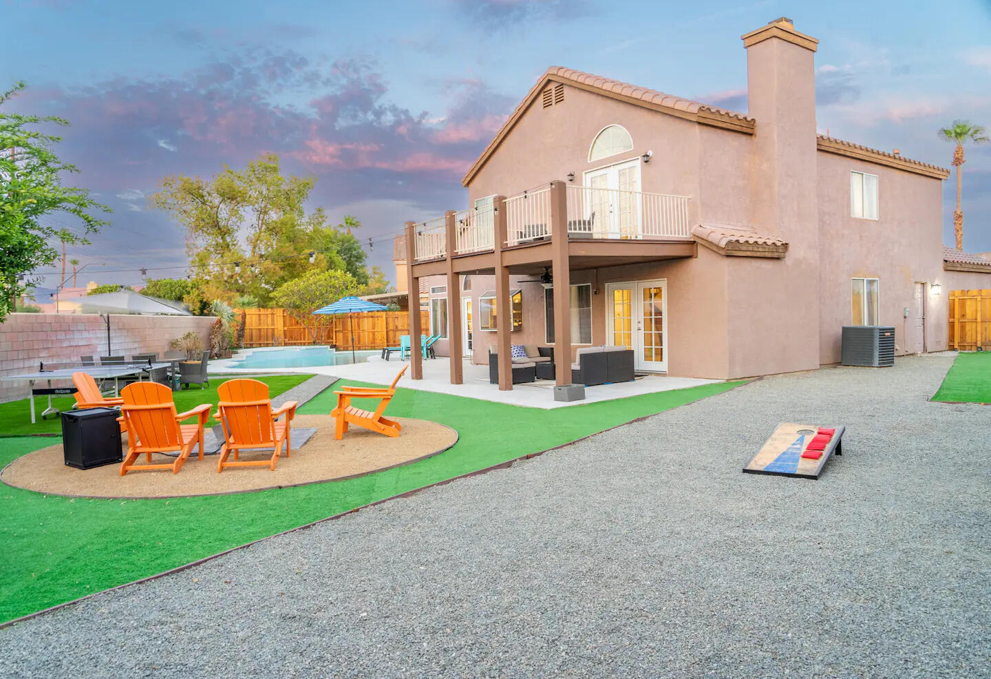 81032 Red Bluff Road Indio, CA 92201 - Photo 2 of 33 a front view of a house with swimming pool