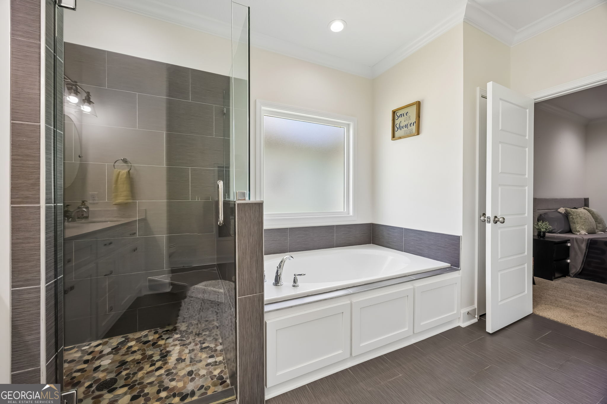 152 Verano Street Kingsland, GA 31548 - Photo 21 of 55 a bathroom with a tub and a shower