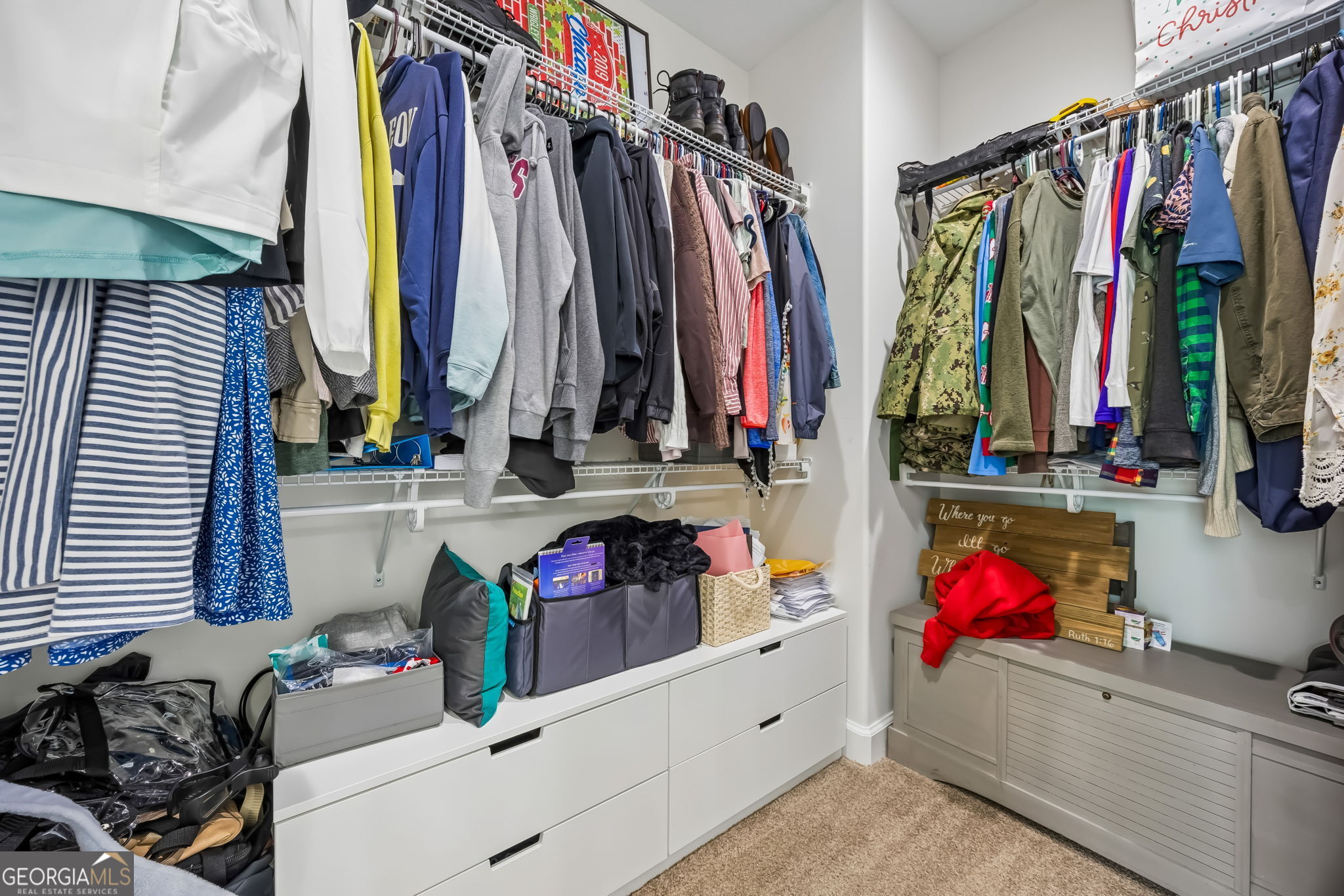 152 Verano Street Kingsland, GA 31548 - Photo 22 of 55 a view of walk in closet with clothes and shoes