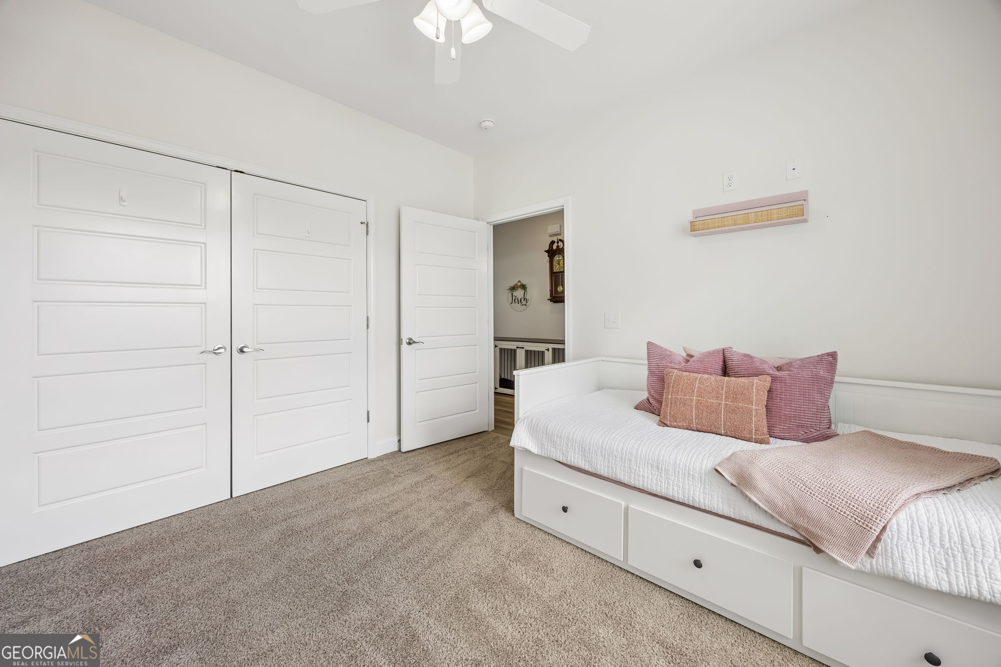 152 Verano Street Kingsland, GA 31548 - Photo 24 of 55 a bedroom with a bed and a chandelier
