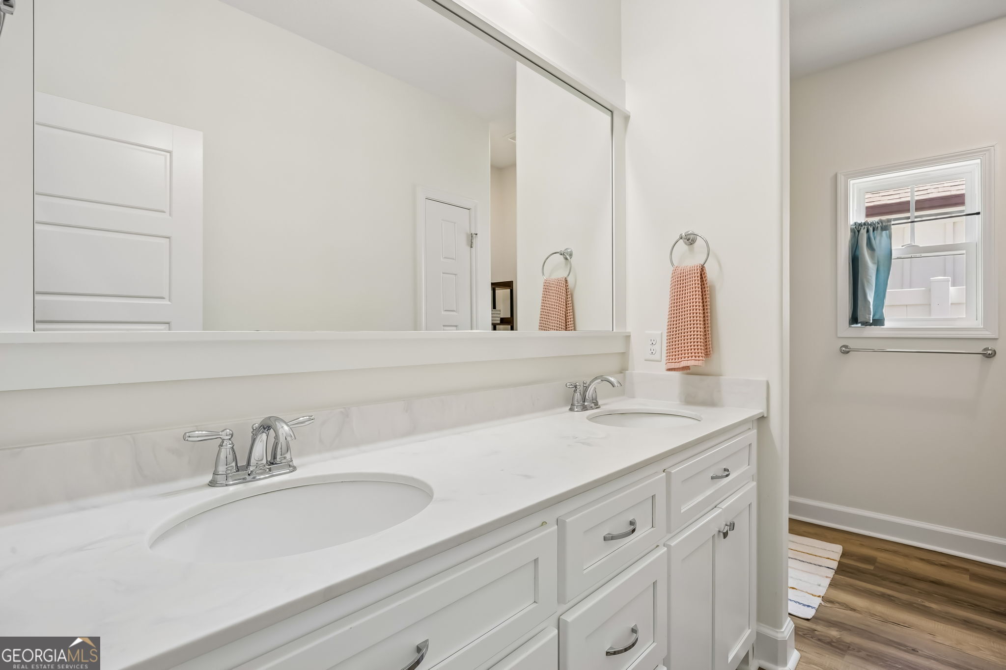 152 Verano Street Kingsland, GA 31548 - Photo 27 of 55 a bathroom with double sink and a mirror