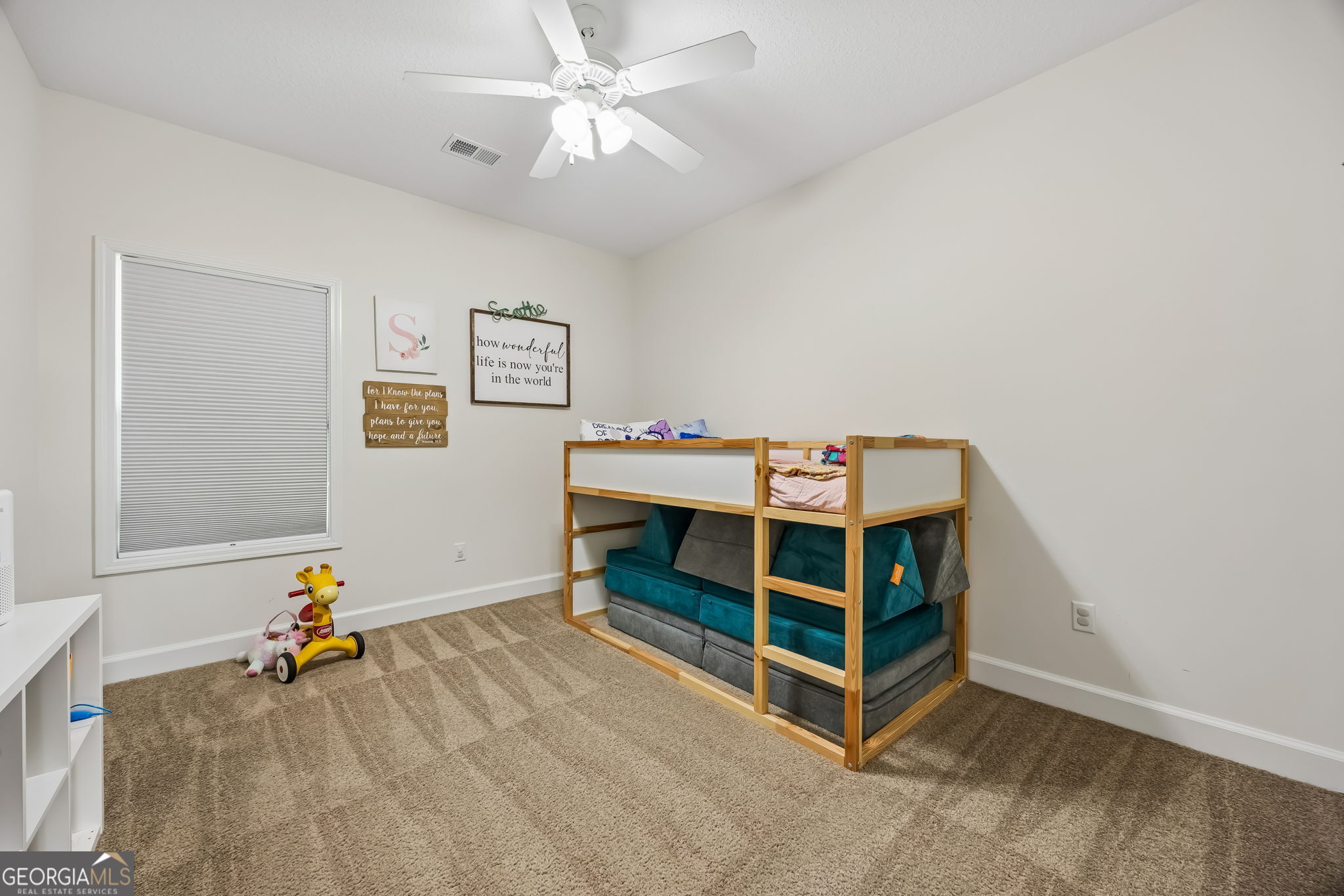 152 Verano Street Kingsland, GA 31548 - Photo 29 of 55 a bedroom with a bed and a chandelier