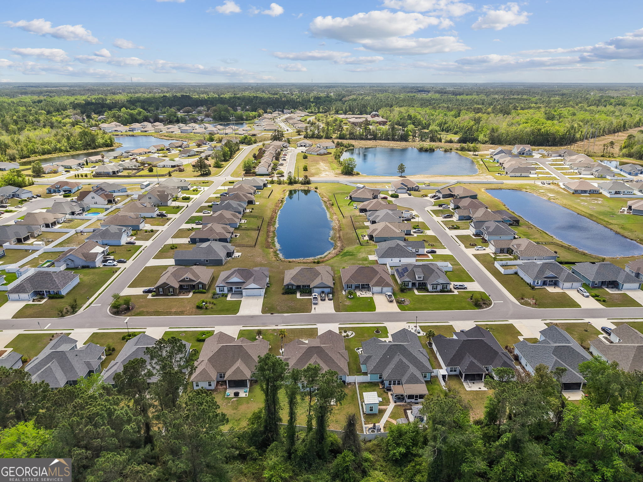 152 Verano Street Kingsland, GA 31548 - Photo 50 of 55 an aerial view of residential houses with outdoor space