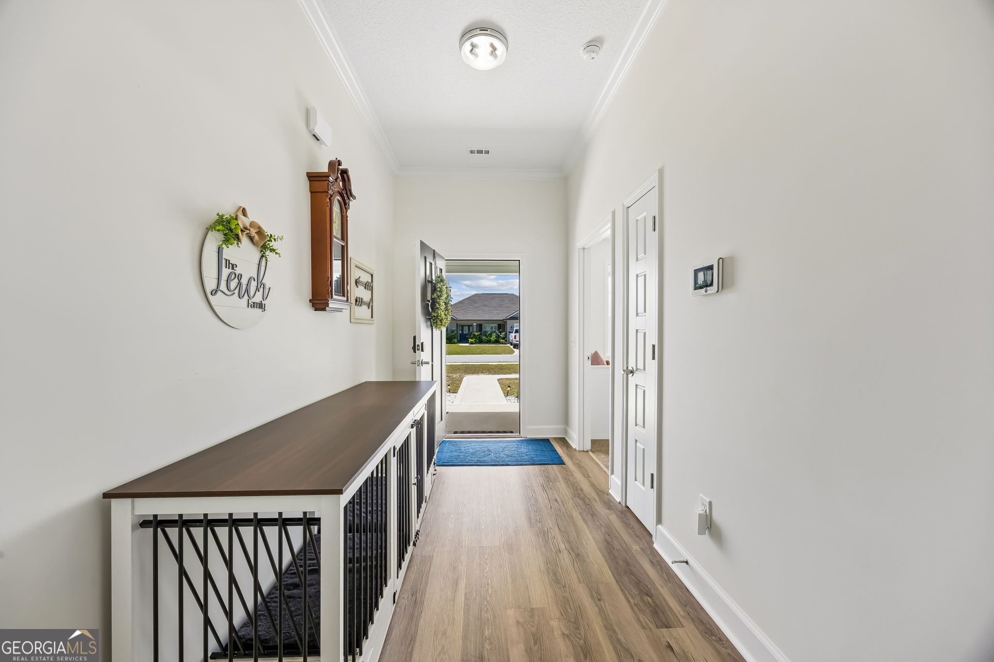152 Verano Street Kingsland, GA 31548 - Photo 6 of 55 a view of a hallway with wooden floor