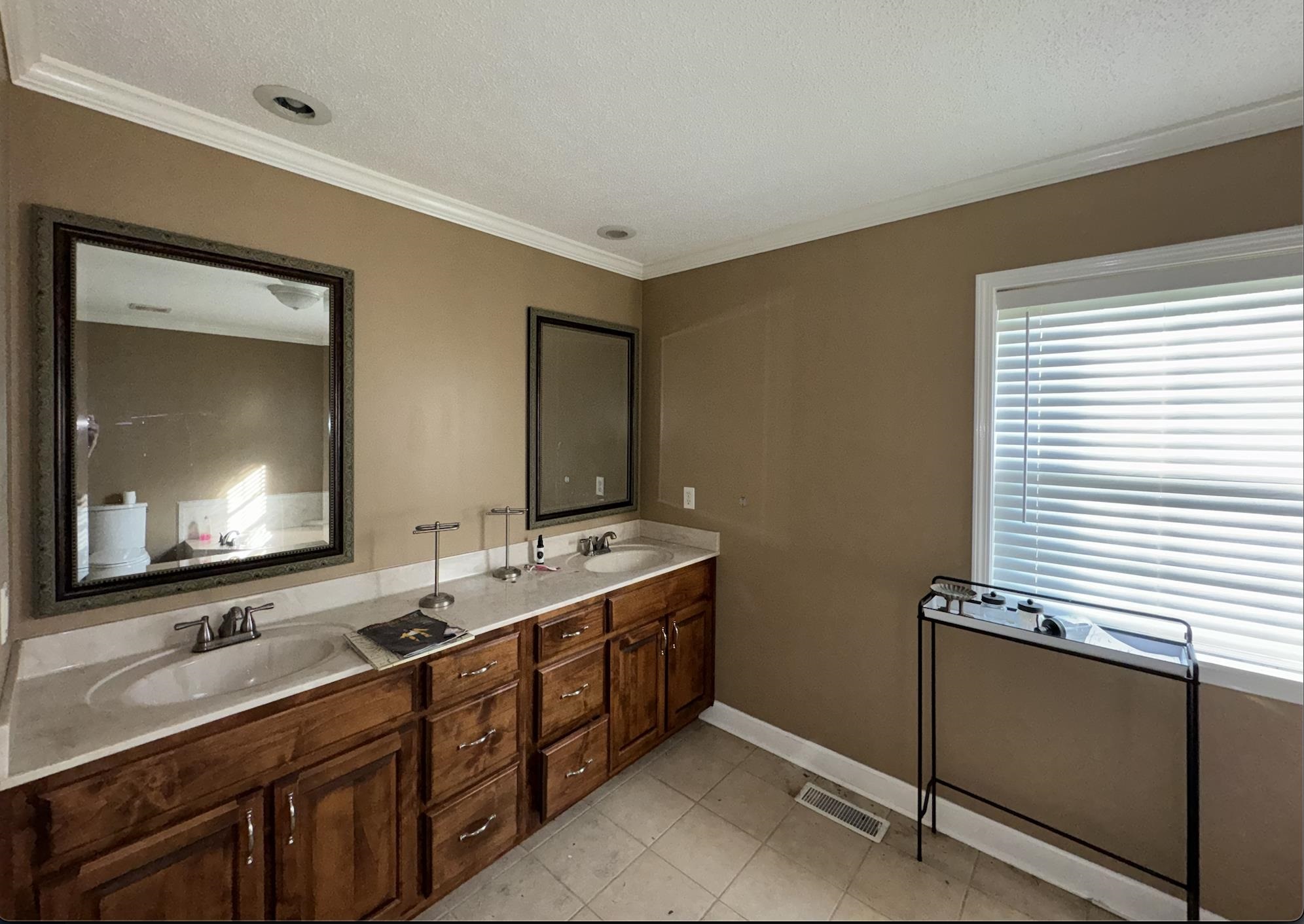 1336 Dunlap Orphanage Road Brighton, TN 38011 - Photo 13 of 14 Bathroom with tile floors, crown molding, and double sink vanity