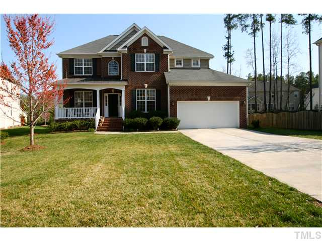 8413 Dunnington Circle Raleigh, NC 27613 - Photo 1 of 21 a front view of a house with a yard