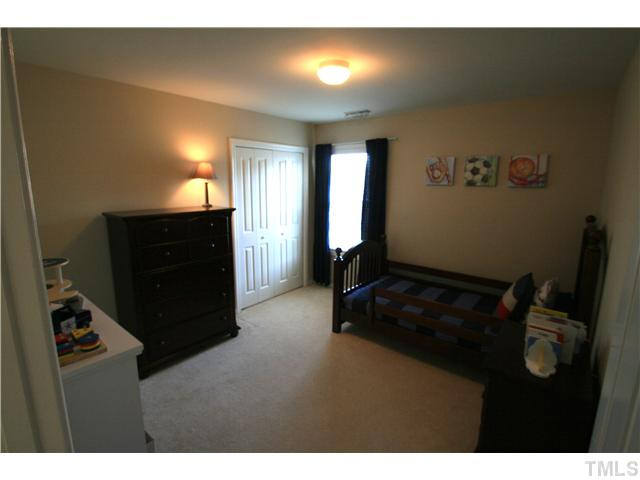 8413 Dunnington Circle Raleigh, NC 27613 - Photo 15 of 21 a living room with furniture and a flat screen tv