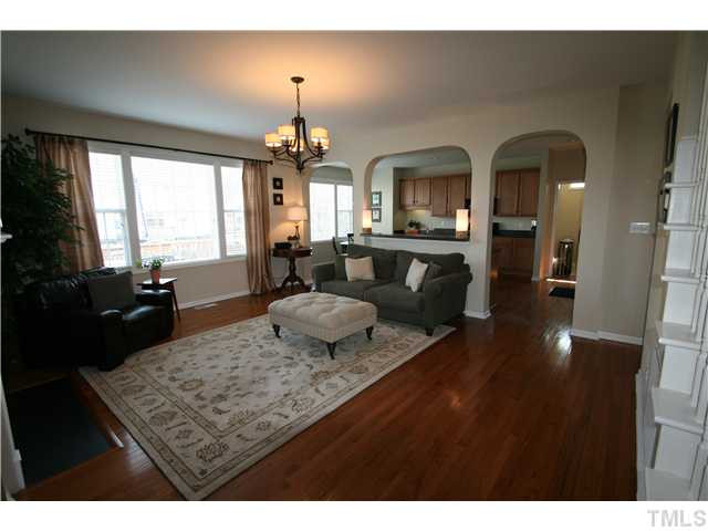 8413 Dunnington Circle Raleigh, NC 27613 - Photo 2 of 21 a living room with furniture rug and wooden floor