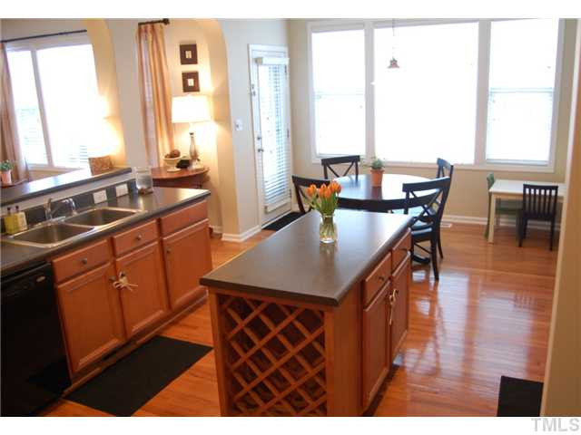 8413 Dunnington Circle Raleigh, NC 27613 - Photo 5 of 21 a kitchen with a sink a counter top space and appliances