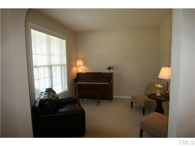 8413 Dunnington Circle Raleigh, NC 27613 - Photo 8 of 21 a living room with furniture and a window