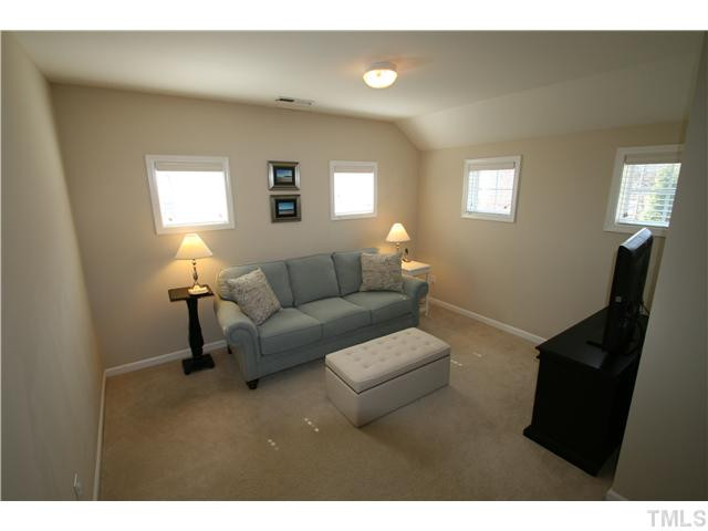 8413 Dunnington Circle Raleigh, NC 27613 - Photo 10 of 21 a living room with furniture and a window