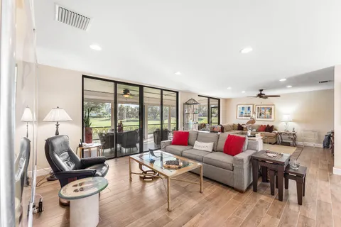 a kitchen with granite countertop white cabinets and stainless steel appliances